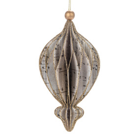 A finial shaped paper cut ornament made from musical notation paper and dusted with gold on the edges.
