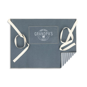 A gray and white half apron with cream ties and a pocket with the saying "Hot off Grandpa's Grill".