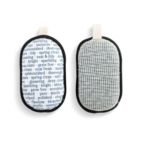 A set of two absorbent sponges in black and white with descriptor words for clean. Each has a fabric tab at the top for hanging.