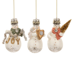 Three different small snowman ornaments decorated with silver sparkle and each holding a different item such as a heart or tree.