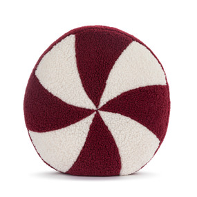 A round red and white pillow that looks like a peppermint candy.