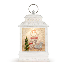 A white lit musical lantern with the image of Pooh and Piglet in a cozy holiday living room.