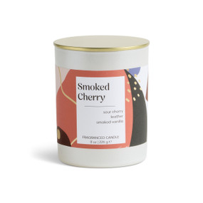 An 8 oz smoked cherry scented candle in a round white container with a gold lid.