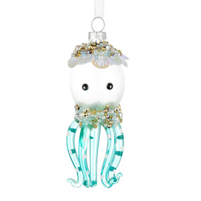 A white and blue octopus shaped ornament decorated with white and gold beads.