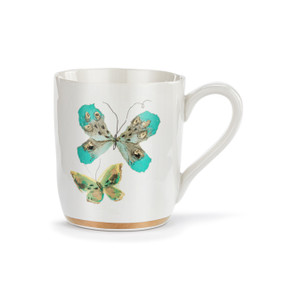 A white ceramic mug with two art butterflies in turquoise and green and a gold trim around the base.