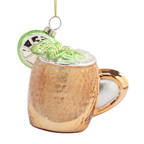 A hanging ornament of a copper mug with a Moscow Mule drink inside.
