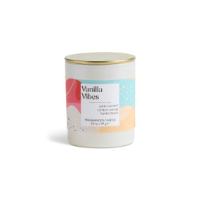 A 3.5 oz vanilla vibes scented candle in a round white container with a gold lid.