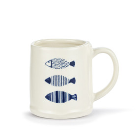 A white ceramic mug with three different illustrated dark blue fish.