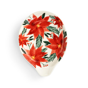 A white ceramic spoon rest with illustrated red poinsettia flowers.