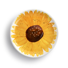A small round ceramic plate painted on the inside to look like a yellow sunflower.