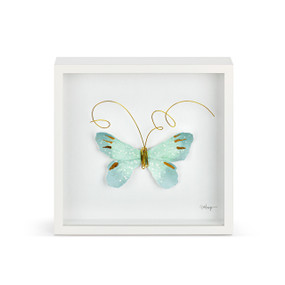 A light green butterfly with gold wire tentacles in a white square framed wall art.
