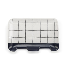 A rectangular blue and white plaid ceramic double spoon rest.