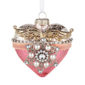 A pink and silver heart shaped ornament decorated with beads and gold angel wings.
