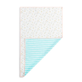 A rectangular double sided towel. One side is white with small illustrated flowers and the other is light blue stripes, displayed with the blue corner turned back.
