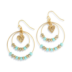A pair of multi hoop gold earrings with turquoise and gold beads on the hoops and a gold heart charm in the middle.
