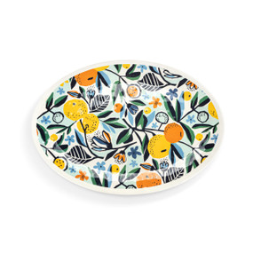 A white oval melamine platter with orange and green citrus illustrations.