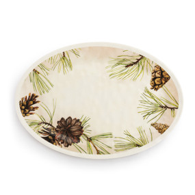A cream oval melamine platter with an illustration of green pine branches and pinecones around the outside.