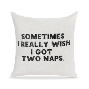 A square white pillow with the saying "Sometimes I really wish I got two naps" on the front.