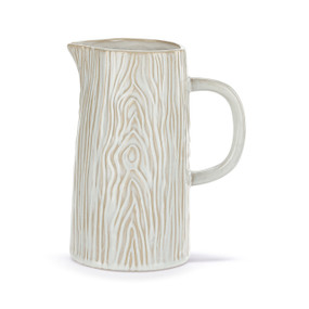A white pitcher with a handle and a wood grain appearance.