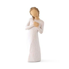 Front view: Standing figure in cream dress with hands to heart in empathetic gesture