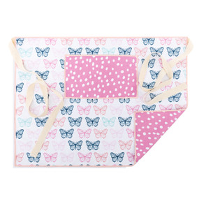 A white and pink half apron with a butterfly pattern on the front along with a pocket and cream ties.