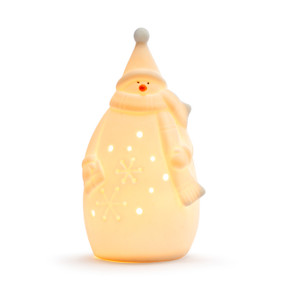 A white ceramic snowman with a scarf that lights up, displayed lit up.