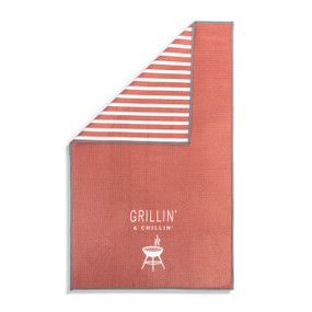 A red and white double sided towel that has the saying "Grillin' & Chillin'". The towel is turned over at a corner showing the red and white striped back.