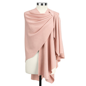 A coral travel wrap with a keyhole on the left shoulder displayed on a mannequin.