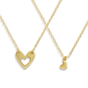 A set of sharing gold chain necklaces with nesting heart charms.