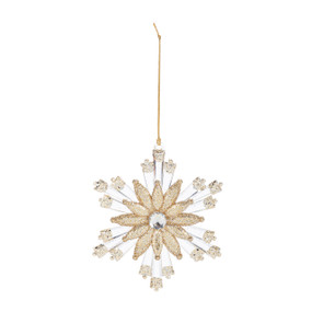 A flower shaped ornament decorated with gold glitter.