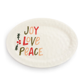 A white oval melamine platter with the words "Joy Love Peace" on the left side in red, green and tan.