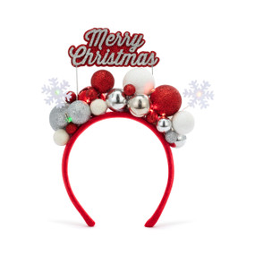 A red holiday light up headband with red, silver and white balls and a sign that says "Merry Christmas" on the top.