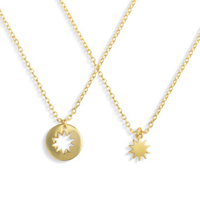 A set of sharing gold chain necklaces with nesting sun charms.