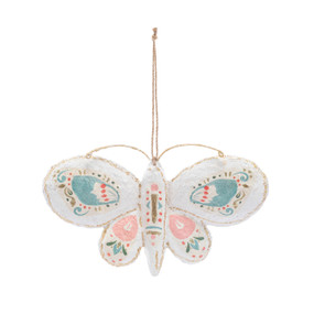 A white paper mache butterfly ornament with painted designs in pastel blue and pink.