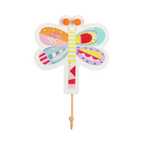 A white wall hook shaped like a dragonfly and decorated with pastel shapes and colors. An orange hook hangs from the bottom.