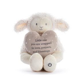 A white plush lamb holding a tan plush heart with a loving message.