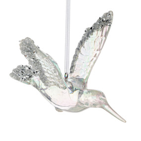 A clear ornament of a hummingbird in flight with silver sparkle and beads on its wings and tail.