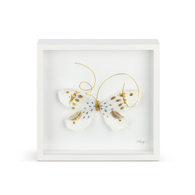 A white and gold butterfly with gold wire tentacles in a white square framed wall art.