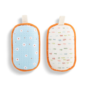 A set of two absorbent sponges in light blue with illustrated daisies. Each has a fabric tab at the top for hanging.