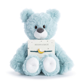 A light blue plush teddy bear with an attached bracelet with a moon charm intended for a child.