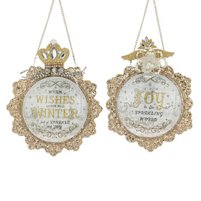 Two different disc ornaments covered in gold glitter and beads with a holiday greeting on each.