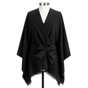 A black fringed wrap with a tie waist displayed on a mannequin.