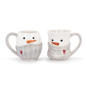 Two different white snowman mugs. Each is wearing a gray scarf with a red heart.