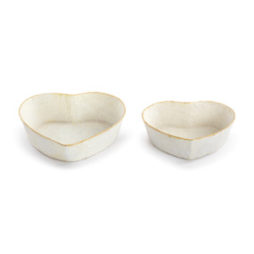 Two cream heart shaped paper mache bowls with gold rims. Each is a different size.