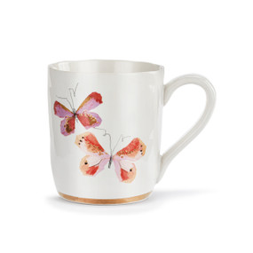 A white ceramic mug with two art butterflies in shades of pink and a gold trim around the base.
