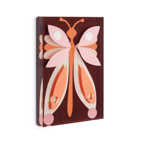 A brown acrylic wall art tile with an illustrated pink and orange butterfly displayed angled to the right.