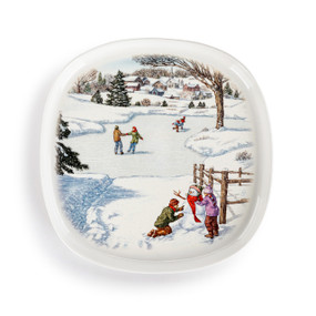 A square white ceramic plate with an image of children playing in a snowy landscape in the middle.