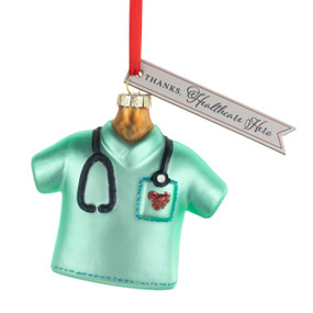 A green scrub top healthcare ornament with a tag saying "Thanks, Healthcare Hero".