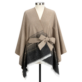 A black and tan fringed wrap with a tie waist displayed on a mannequin.