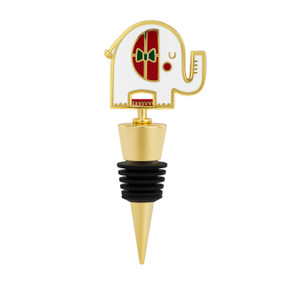 A gold and black bottle stopper with a white elephant on top.